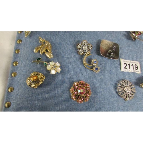 2119 - Approximately 40 vintage and mid 20th century brooches in various designs including a mermaid.