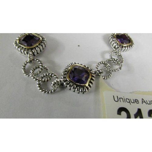 2127 - A pretty purple stone set bracelet in silver.