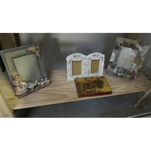 1202 - Approximately 25 assorted photo frames (4 with art deco style prints) and including 2 framed and gla... 