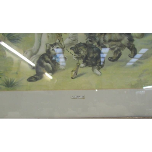 1204 - A 1930's oak framed print entitled 'Playmates' depicting a girl with a Saint Bernard dog and cats,  ... 