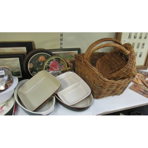 1207 - A mixed lot of place mats, coasters, baskets etc., together with 4 earthenware dishes and a Pyrex ty... 