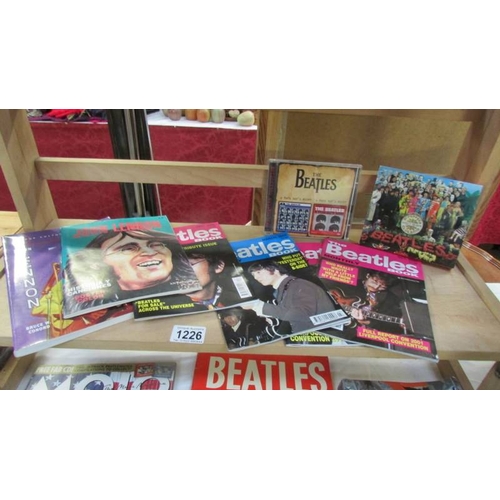 1226 - A mixed lot of Beatles memorabilia including a rare 4 cassette boxed set, a (Spanish) song book of J... 