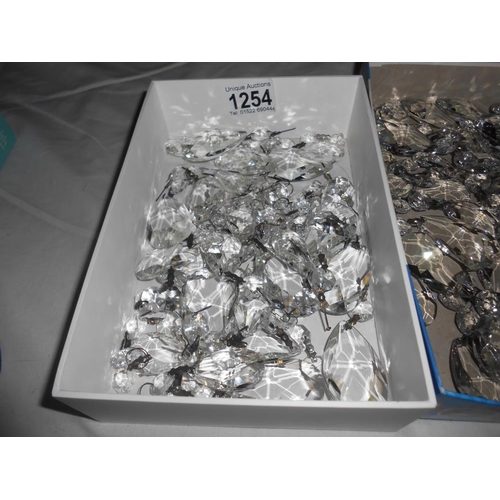 1254 - A quantity of glass lustres in 3 trays