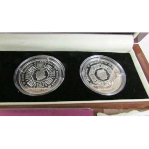 2134 - A cased set of four 60th anniversary of the coronation of Queen Elizabeth II silver coins featuring ... 