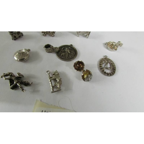 2135 - 15 assorted charms including some silver but mostly unmarked.