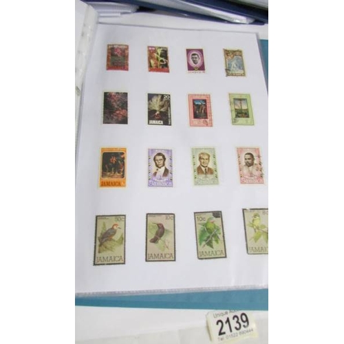 2139 - Ten albums of stamps including Poland, Szechoslovakia, Singapore, Malasia etc.,