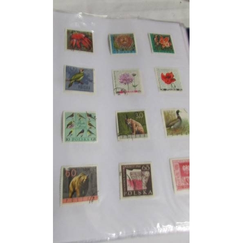 2139 - Ten albums of stamps including Poland, Szechoslovakia, Singapore, Malasia etc.,