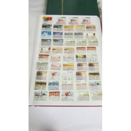 2140 - Five large stock books of stamps including Canada, Commonwealth, Australia etc.,