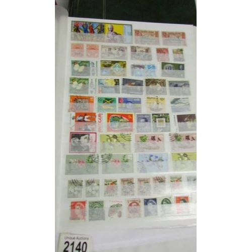 2140 - Five large stock books of stamps including Canada, Commonwealth, Australia etc.,