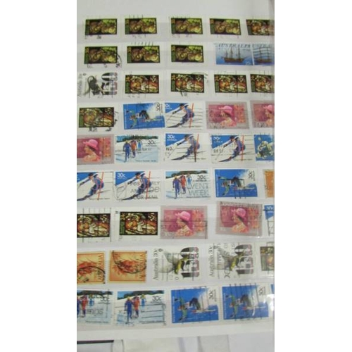 2140 - Five large stock books of stamps including Canada, Commonwealth, Australia etc.,