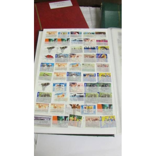 2140 - Five large stock books of stamps including Canada, Commonwealth, Australia etc.,