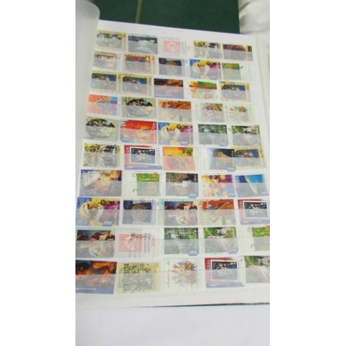 2140 - Five large stock books of stamps including Canada, Commonwealth, Australia etc.,