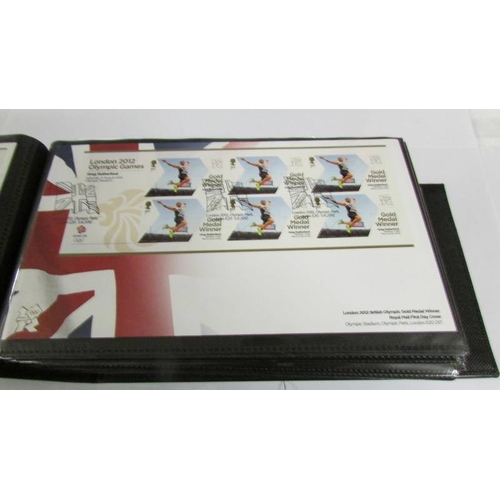 2142 - An Olympic Paralympic Games 2012 album of first day covers and a quantity of 2000 - 2001 first day c... 