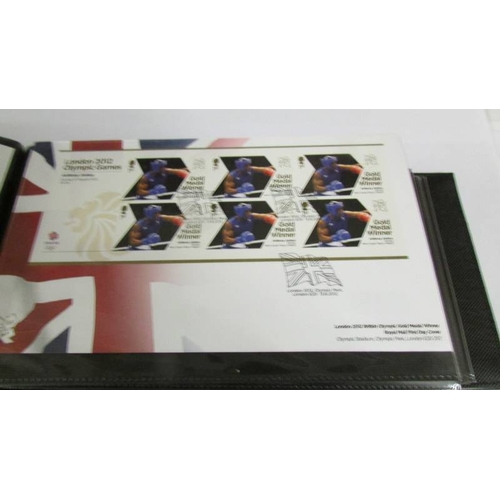 2142 - An Olympic Paralympic Games 2012 album of first day covers and a quantity of 2000 - 2001 first day c... 