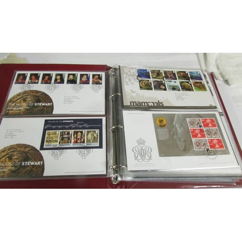 2145 - A quantity of first day covers in 4 albums.