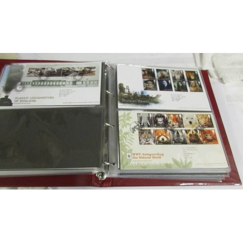 2145 - A quantity of first day covers in 4 albums.