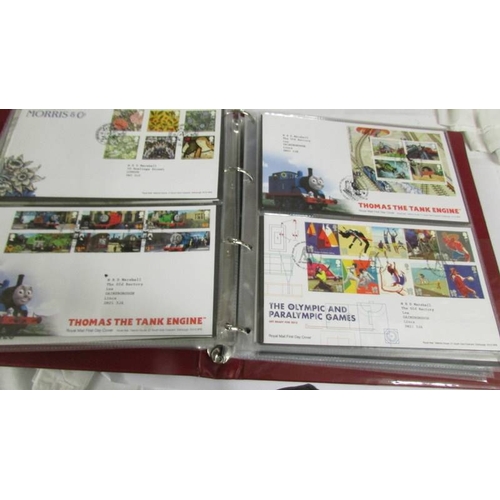 2145 - A quantity of first day covers in 4 albums.