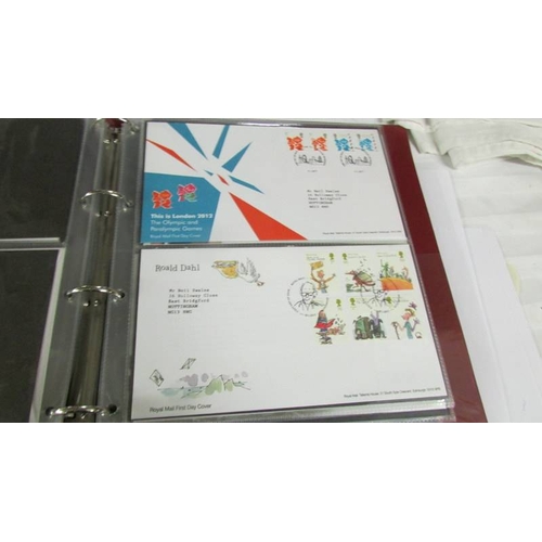 2145 - A quantity of first day covers in 4 albums.