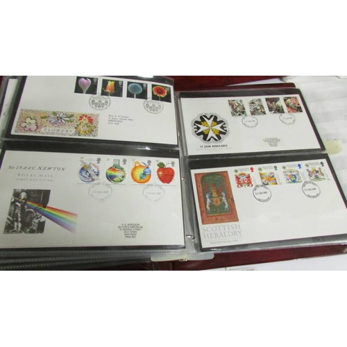 2145 - A quantity of first day covers in 4 albums.