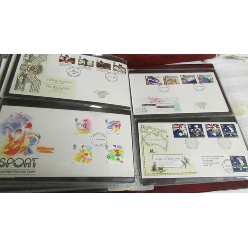 2145 - A quantity of first day covers in 4 albums.