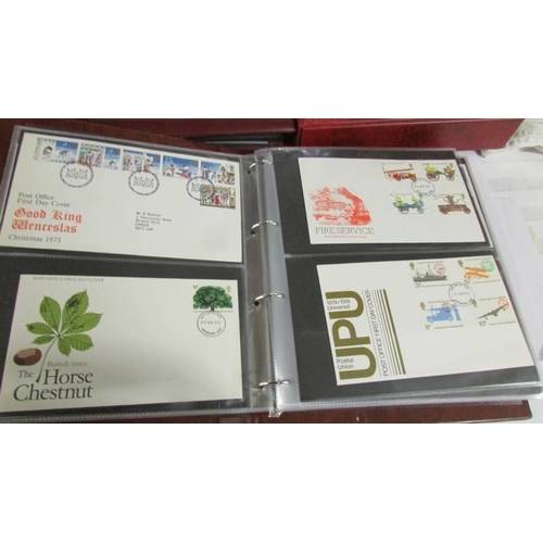 2145 - A quantity of first day covers in 4 albums.