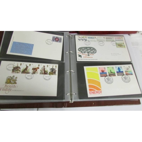 2145 - A quantity of first day covers in 4 albums.