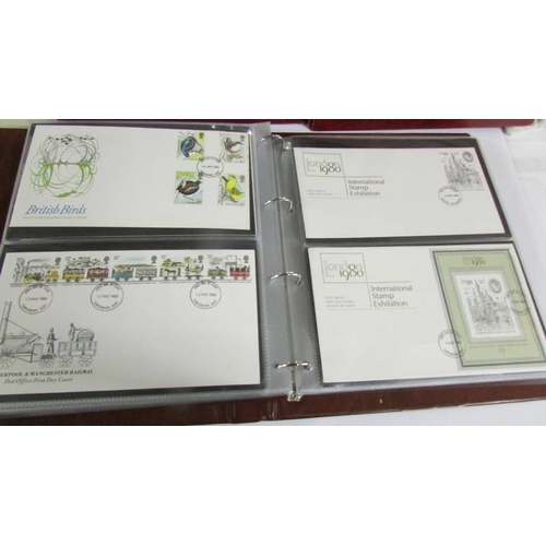 2145 - A quantity of first day covers in 4 albums.