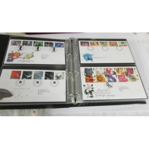 2145 - A quantity of first day covers in 4 albums.