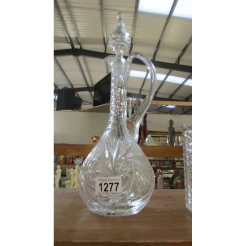 1277 - Two square cut glass decanters (stoppers a/f) and one other.