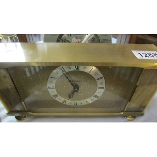 1288 - A 'Lord King' world time clock, a Staiger quartz clock and an anniversary clock under perspex dome..