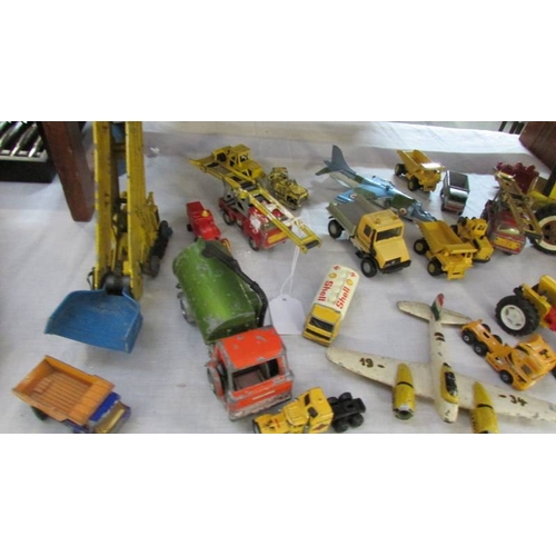 1293 - A collection of metal Tonka toys, digger etc., and a quantity of construction vehicles including Din... 