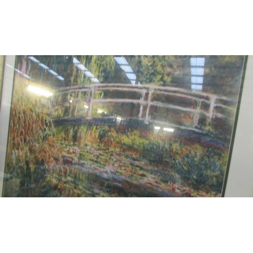 1399 - A framed and glazed vibrant print of Monet's 'Bridge at Giverny' (88 x 78 cm).