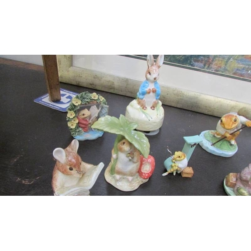 1400 - A collection of Beatrix Potter figures including musical including Border Fine Arts, Royal Albert an... 