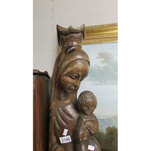 2196 - A tall carved figure of Madonna and child, 39'' tall.