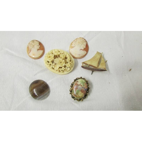 2234 - A mixed lot of including small purse, 2 shell cameos, brooches etc.,