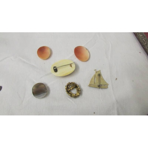 2234 - A mixed lot of including small purse, 2 shell cameos, brooches etc.,