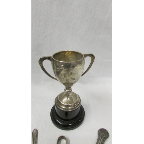 2235 - A mixed lot of hall marked silver including trophy, bottle top, spoons, bracelet, sugar nips etc.,