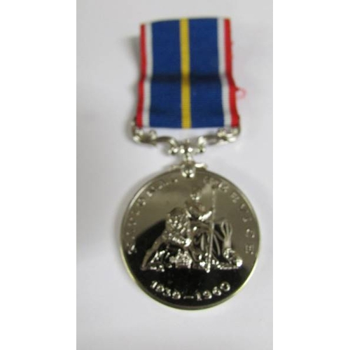 2239 - A boxed National Service medal.