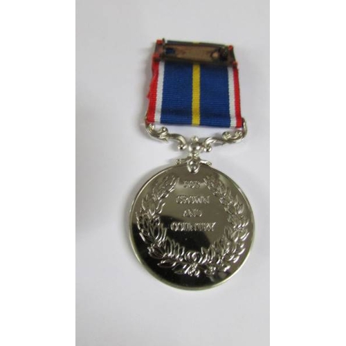 2239 - A boxed National Service medal.