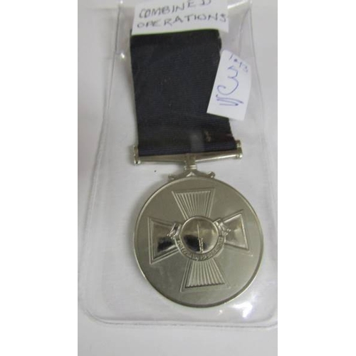 2241 - A boxed U.S.A medal with a boxed Suez Canal Zone medal with bar 'Suez Landings' (engraved personally... 