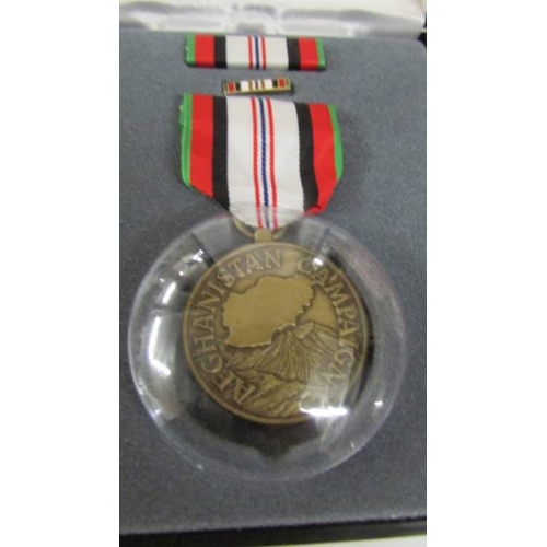 2241 - A boxed U.S.A medal with a boxed Suez Canal Zone medal with bar 'Suez Landings' (engraved personally... 