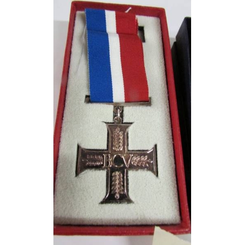 2251 - A boxed British Commonwealth veterans cross and a boxed Active Service cross.