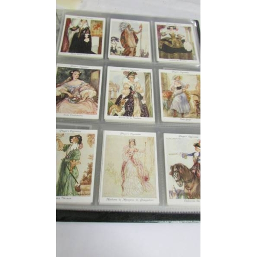 2261 - An album of cigarette cards including Players Dogs, Treasures of Britain, Famous Beauties, Senior Se... 