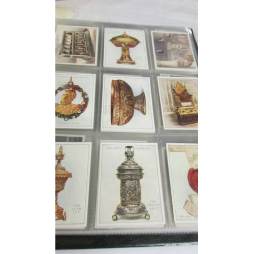 2261 - An album of cigarette cards including Players Dogs, Treasures of Britain, Famous Beauties, Senior Se... 