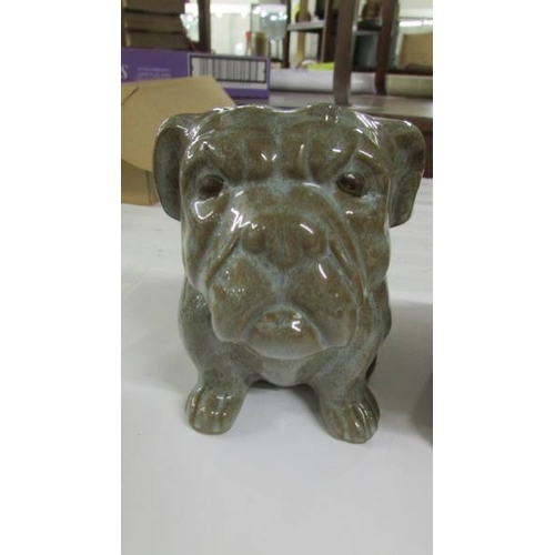 2263 - A pair of glazed potter bull dogs.