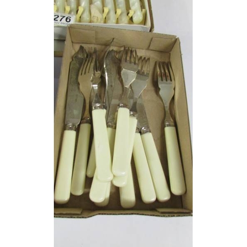 2276 - A boxed set of fish knives and forks and other cutlery.