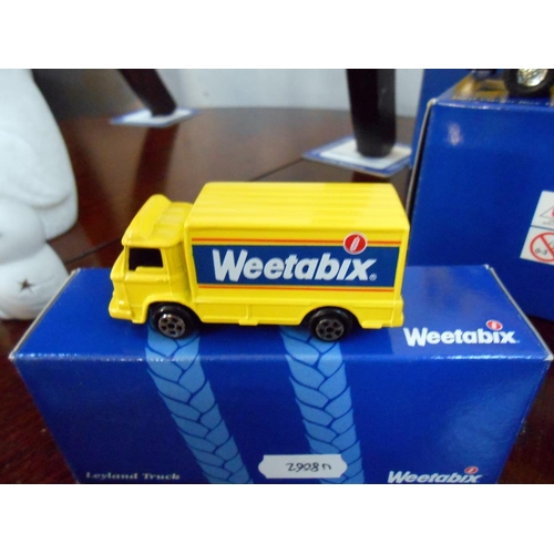 313 - 4 boxed Weetabix Corgi Classic vehicles