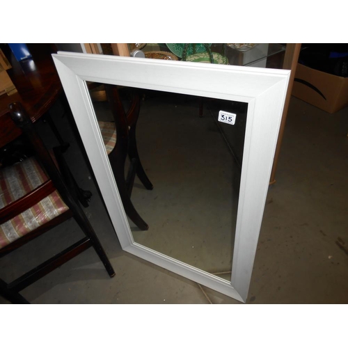 315 - A white wood framed mirror (90cm x 60cm)