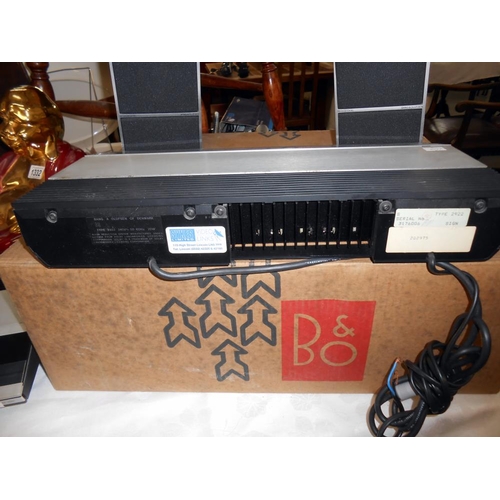 1331 - A Bang & Olufsen (B & O) amplifier, cassette deck, record deck, speakers and VHS player.