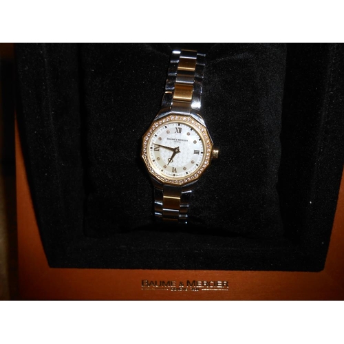 2056 - A boxed Baume & Mercier stainless steel and 750 gold watch with diamonds.